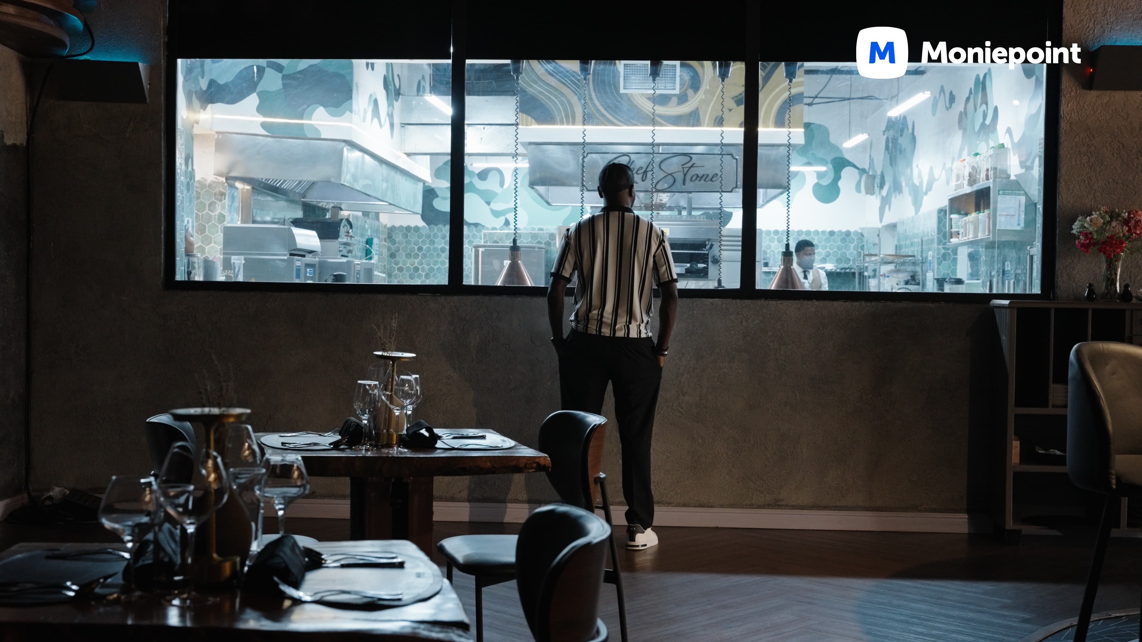 Restaurateur watching the open kitchen at Chef Stone — Moniepoint brand film.