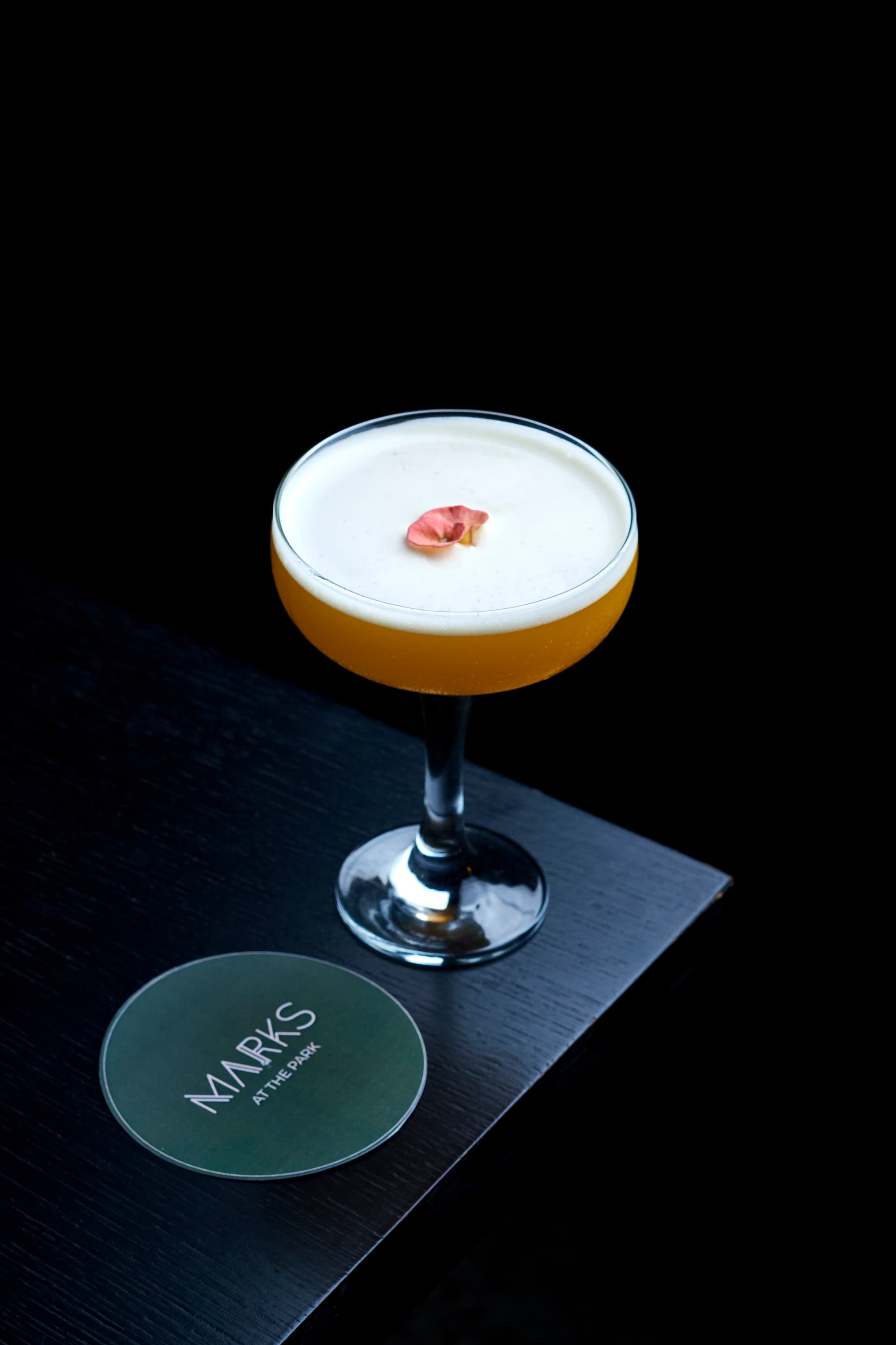 Signature cocktail at Marks at the Park — hospitality campaign.